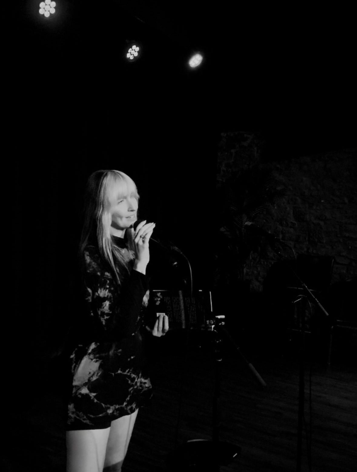 kat. the poet performing on stage